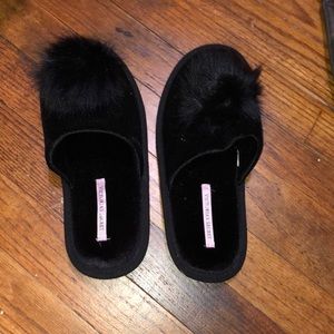 Victoria’s Secret black slippers.